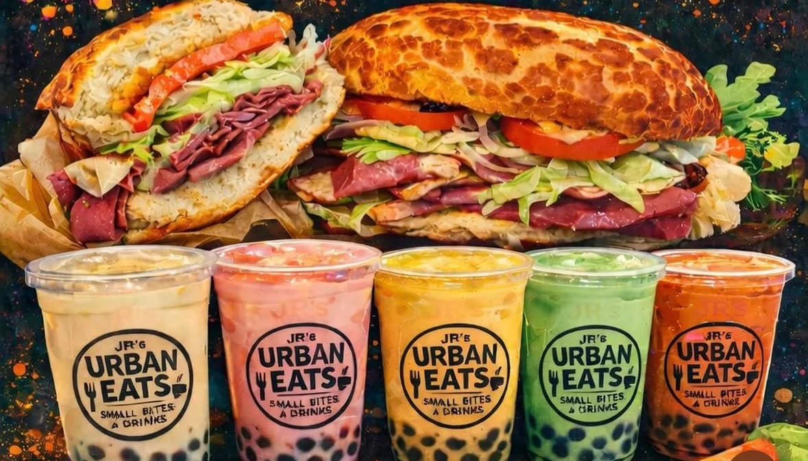 Two stacked Jr's Urban Eats sandwiches lined up beside five colorful boba drinks